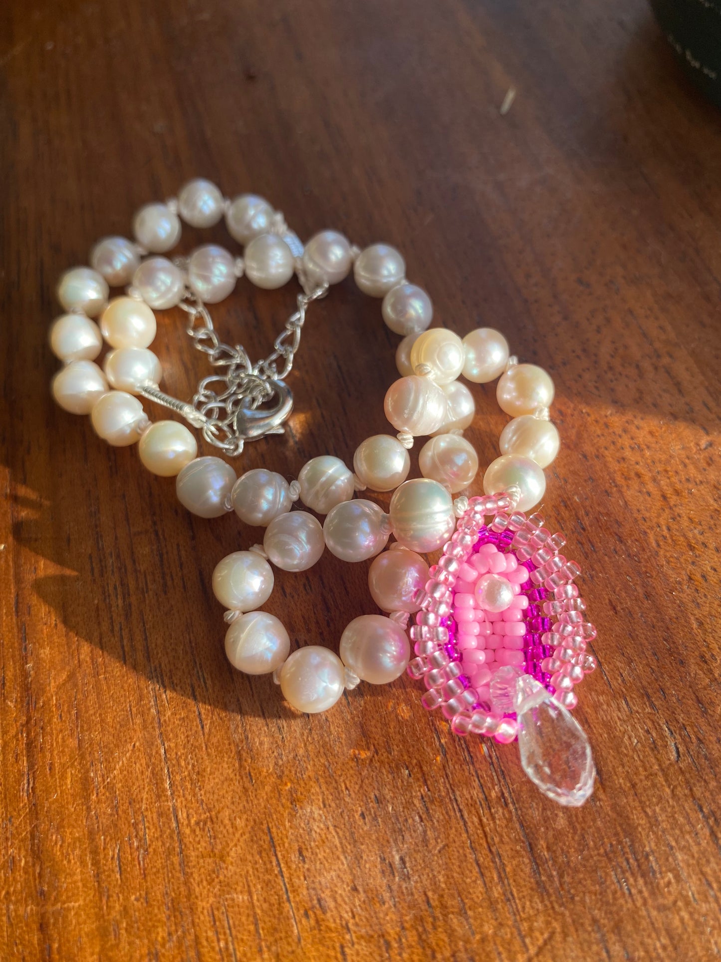 Squirting vulva pendant on fresh water pearl choker